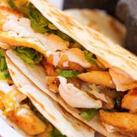 Chicken Quesadilla · Flour tortilla with cheese, lettuce, cotija cheese, side of sour cream and red sauce.