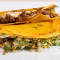 Quesabirria · Two quesadillas filled with Birria meat, cheese, lettuce & sour cream