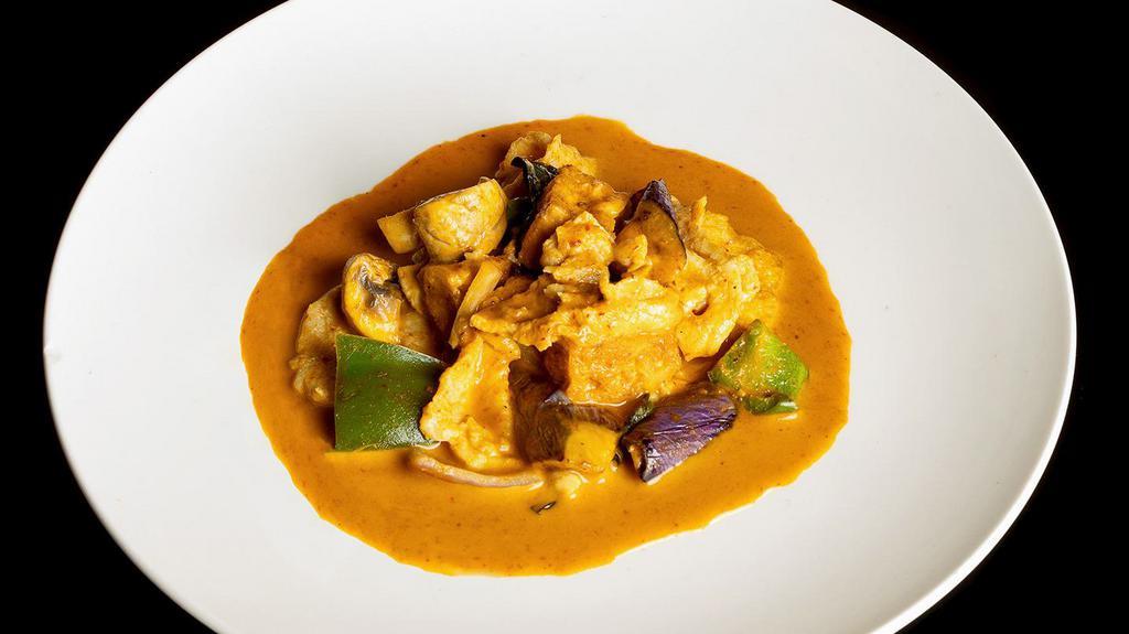 Thai Red Curry  · Spicy. Red curry with fried tofu, eggplant, mushroom, onion, basil leaf, bell pepper and the meat of your choice.