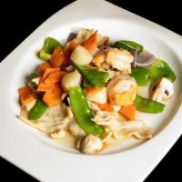 Thai Triple Delight · Spicy. Thai stir fried shrimp, chicken and scallop with snow peas, carrot, shiitake mushroom...