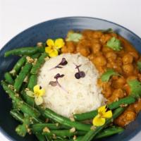 Chickpea Curry · Chickpeas stewed in coconut masala curry sauce
served with flash fried green beans over grain