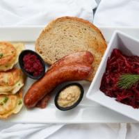 Polish Happy Meal · Kielbasa, three pierogi, and one side, mustard, beet spread, sliced rye.