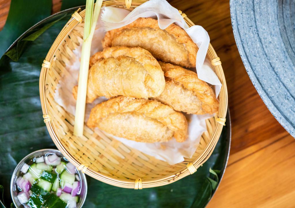 Curry Puff · Stuffed with chicken, potato, onion, and curry powder and served with cucumber relish.