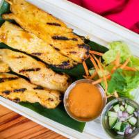Chicken Satay · Served with peanut dipping sauce and cucumber relish.