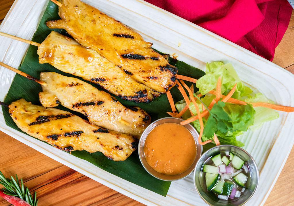 Chicken Satay · Served with peanut dipping sauce and cucumber relish.