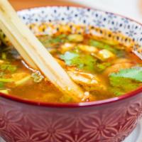 Tom Yum Soup · Hot and sour lemongrass broth with lime juice, pepper, and mushroom. Hot and spicy.
