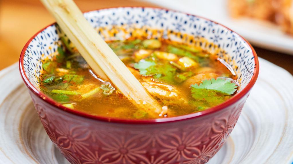 Tom Yum Soup · Hot and sour lemongrass broth with lime juice, pepper, and mushroom. Hot and spicy.