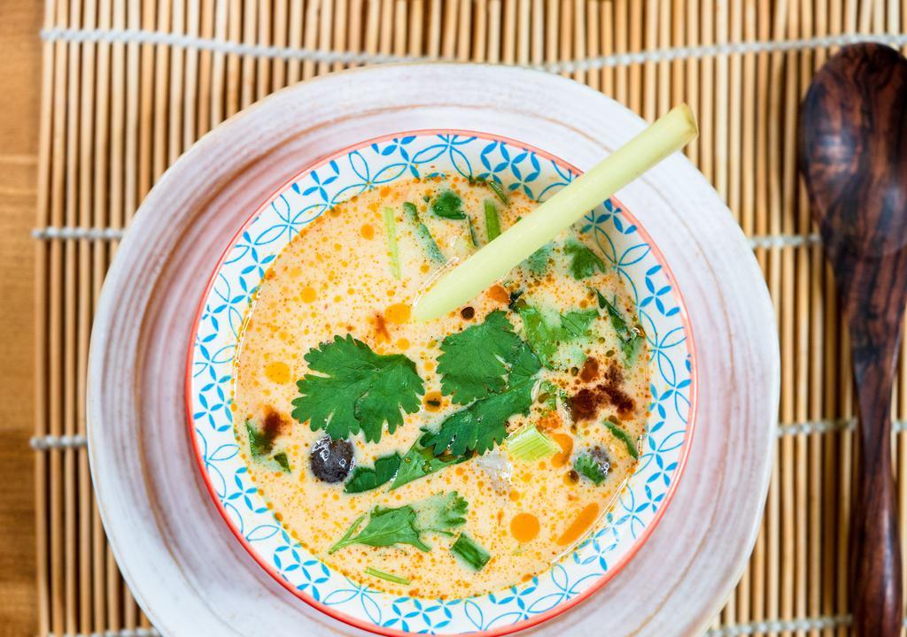 Tom Kha Soup · Galangal coconut milk broth, kaffir lime leaf, pepper, and lime juice. Hot and spicy mushroom.