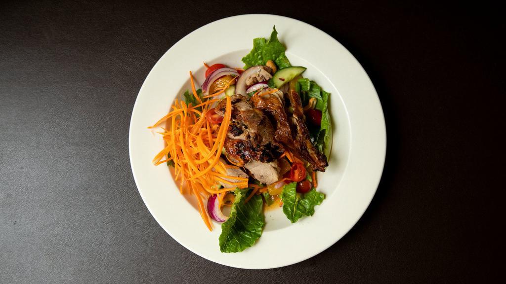 Duck Salad · Yum ped. Crispy duck with mixed greens, sweet onion, scallion, pineapple, and cashew nuts in spicy lime juice. Hot and spicy.