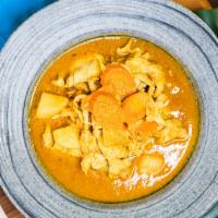 Yellow Curry · A rich, thick yellow curry cooked with coconut milk, potato, and carrots. Hot and spicy.