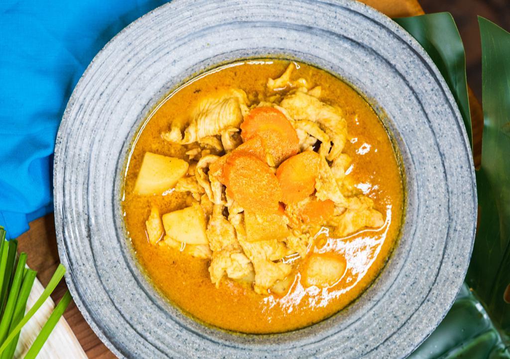 Yellow Curry · A rich, thick yellow curry cooked with coconut milk, potato, and carrots. Hot and spicy.