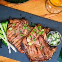 Pork Chop Lemongrass · Grilled thin slices of pork chops marinated with lemongrass, galangal, garlic, and lime juice.
