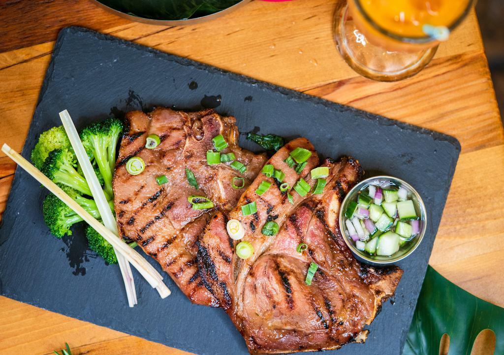 Pork Chop Lemongrass · Grilled thin slices of pork chops marinated with lemongrass, galangal, garlic, and lime juice.