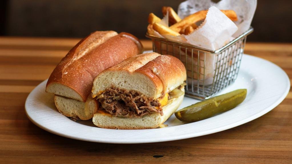Philly Cheese Steak · Sliced beef melted cheese and fried onions. served with french fries.