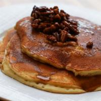 Sticky Tofee Pancakes · Served with toffee syrup caramelized pecans butter and syrup.