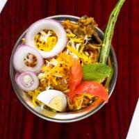 Chicken Biryani · Flavorful rice cooked with cubes of marinated chicken, exotic herbs and spices. Served with ...