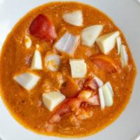 Paneer Makhani · Cubes of fresh homemade cheese stewed in a creamy tomato gravy.