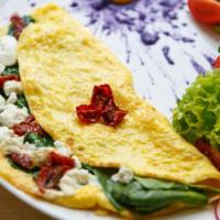 Greek Omelet · Delicious Omelet made with Spinach, onion, tomato, and feta cheese. Served with a side of ho...