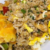 Chaufa De Pollo · Fried rice mixed with eggs, scallions served with chicken.