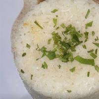 Porcion De Arroz · White rice.