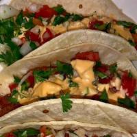 Fish Tacos (3) · Corn tortilla, tomatoes, onion, cilantro and house dressing
