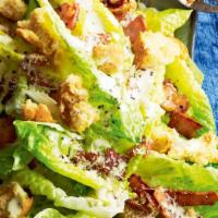 Caesar Salad · Romaine lettuce with savory croutons, fresh Parmesan cheese, and creamy Caesar dressing.