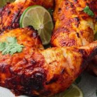 Tandoori Chicken دجاج مشوي · ½ baby chicken marinated in our special Indian sauce, sour cream grilled and smoked in our f...