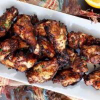 Jerk Chicken (Wings) · Served with your choice of two sides.