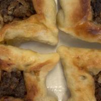 Meat Pies · Homemade bread pies topped with meat, onions and nuts.