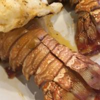 Twin Lobster Tails · 2 5 oz lobster tails broiled and served with 1 side.