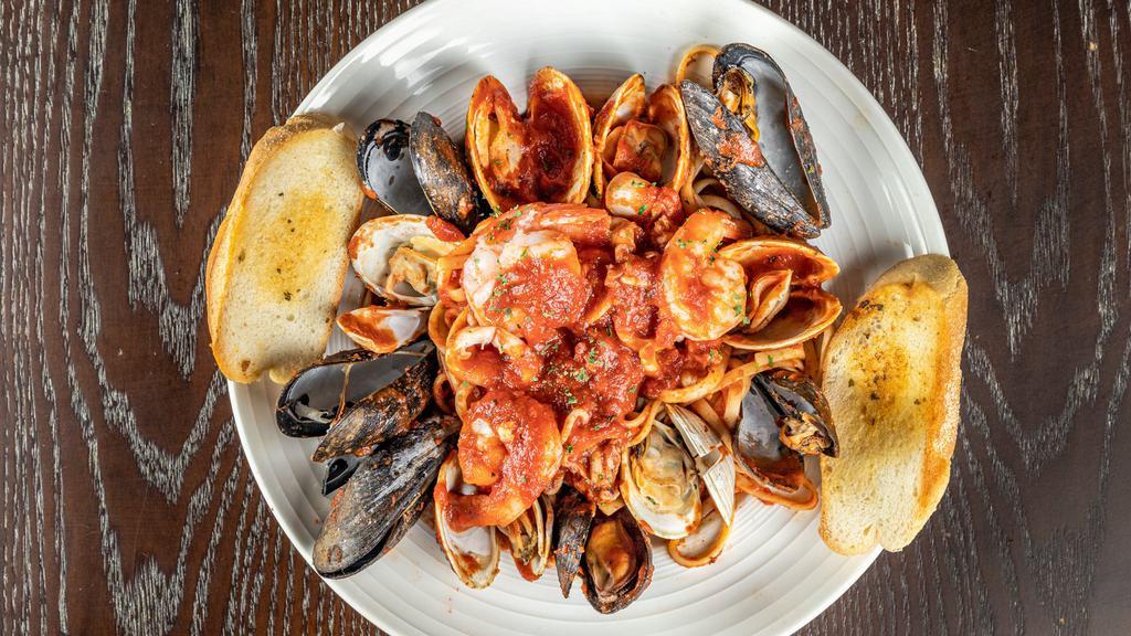 Seafood Fra Diavolo · Mussels, clams, calamari and shrimp in a spicy plum tomato sauce over linguini.