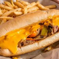 Philly Cheesesteak · Shaved ribeye steak with peppers, onions, and cheddar cheese sauce. Served on a toasted roll.