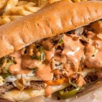 Texas Cheesesteak · Shaved ribeye steak, peppers, onions, jalapenos, smoked bacon, pepper jack cheese, and house...