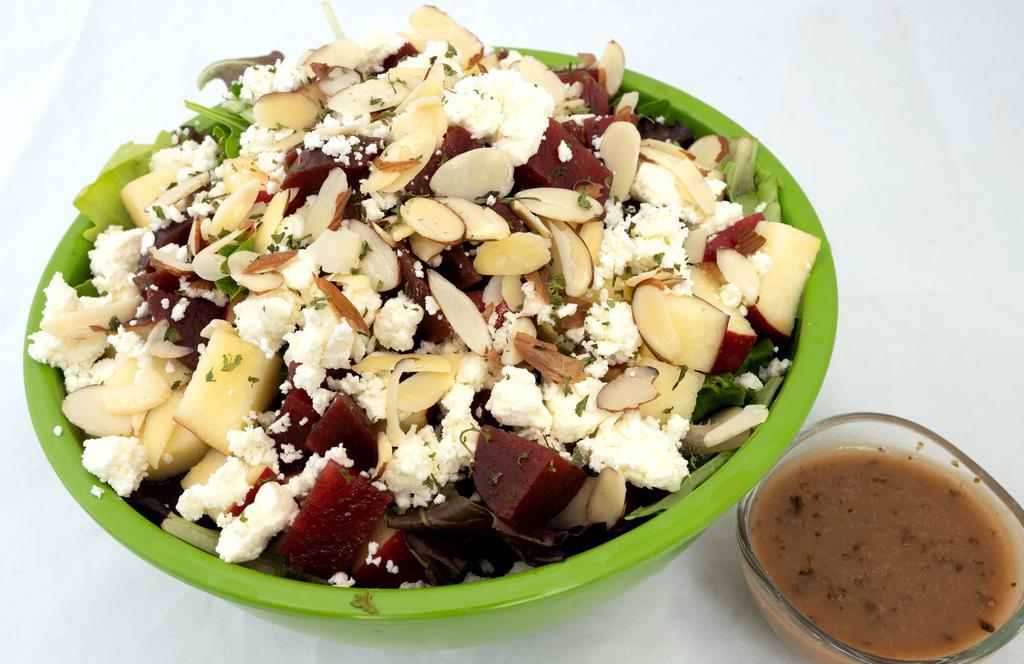 Organic Apple And Roasted Beet Salad  · Organic apples & roasted beet salad over mixed greens topped with feta and blanched almonds. Balsamic dressing