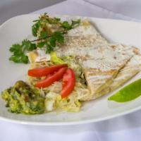 Cheese Quesadilla · Flour tortilla filled with cheese topped with sour cream cotija cheese accompanied with sala...