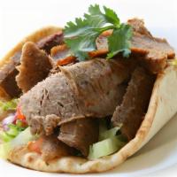 Lamb Gyro · Grilled Lamb, Topped with Lettuce ,Tomatoes and your pick of Sauce, Served on a Pita Bread.