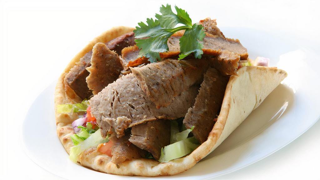 Lamb Gyro · Grilled Lamb, Topped with Lettuce ,Tomatoes and your pick of Sauce, Served on a Pita Bread.