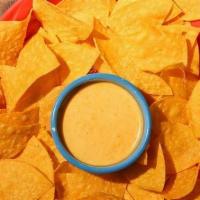 Mexican Queso Dip · A Mild House Blend of Melted Mexican Cheeses Served with Our Housemade Tortilla Chips.