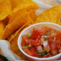 Chips & Salsa · A Bowl of Our Housemate Tortilla Chips Served with Fresh Pico de Gallo.
