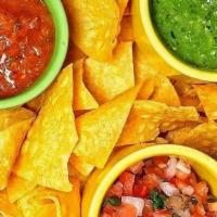 Chips & Salsa Sampler · House Made Tortilla Chips Served with Roasted Tomato Salsa, Salsa Verde and Pico de Gallo.