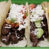 Tacos De Carne · Steak topped with guacamole, pico de gallo and queso fresco.