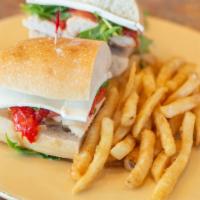 Pollo Panini · Grilled chicken with arugula, balsamic vinegar, tomatoes, roasted pepper and fresh mozzarella.