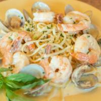Shrimp Scoglio · Shrimp and clams in a delicate cream sauce and over pasta. Served with pasta and salad.