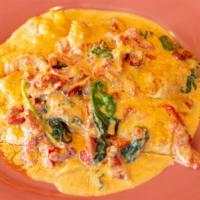 Chicken Rosa · Sauteed with roasted red peppers, spinach and sun-dried tomatoes in a pink cream sauce. Serv...
