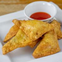 Crab Ragoon (6) · 6 pieces fried cheese wontons with sweet passionfruit sauce.