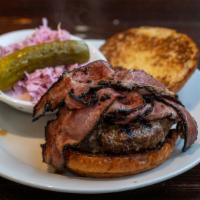 Deli Burger · Choice of beef or turkey burger topped with grilled pastrami and Russian dressing.