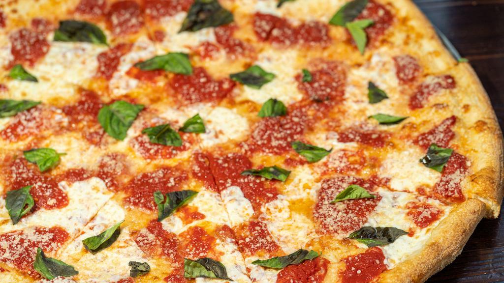 Margherita Pizza · Mozzarella, tom sauce, basil, and olive oil.