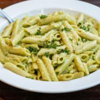Pasta Pesto · Served with fresh basil and garlic in a creamy pesto sauce.