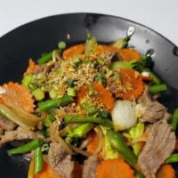 Pad Ginger · Fresh ginger, string bean, bell pepper, onion, carrot, broccoli in a garlic sauce, Topped wi...