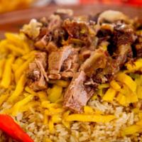 Uzbek Plov · Made with beef, lamb, rice, carrot, raisins, and chickpeas.